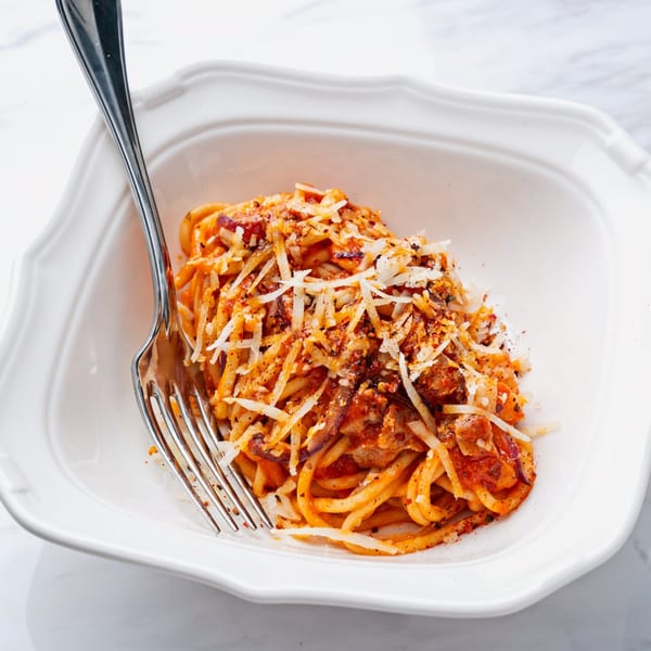 Officina's bucatini all'amatriciana, a pasta dish with tomato sauce, guanciale, and pecorino cheese.