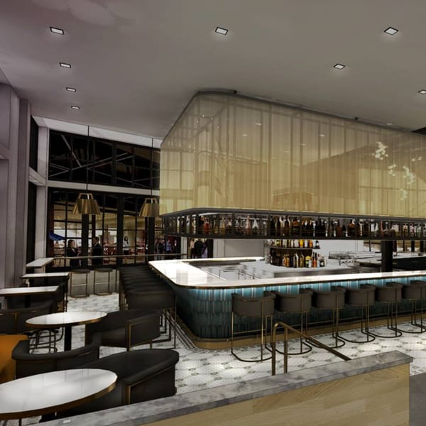 Officina's modern bar area with a long, curved bar, high stools, and tables with chairs.