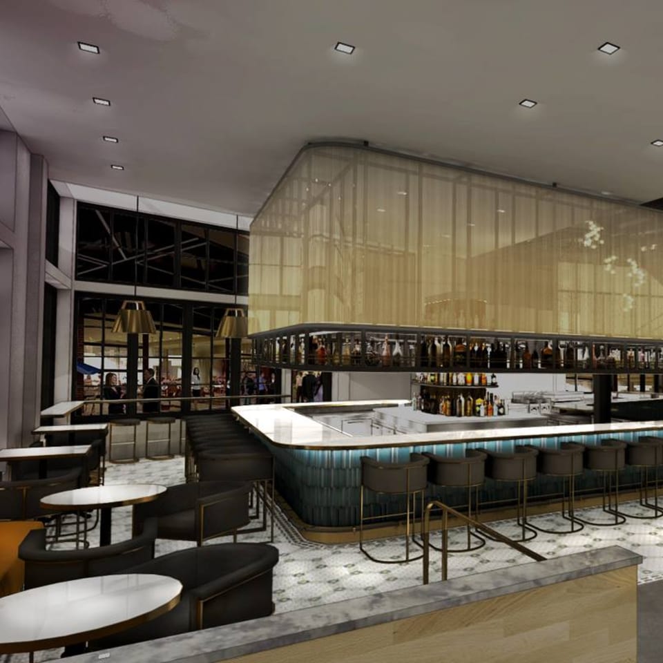 Officina's modern bar area with a long, curved bar, high stools, and tables with chairs.